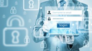 Person in a suit holding a tablet with login screen overlay, featuring username and password fields, surrounded by security lock icons.