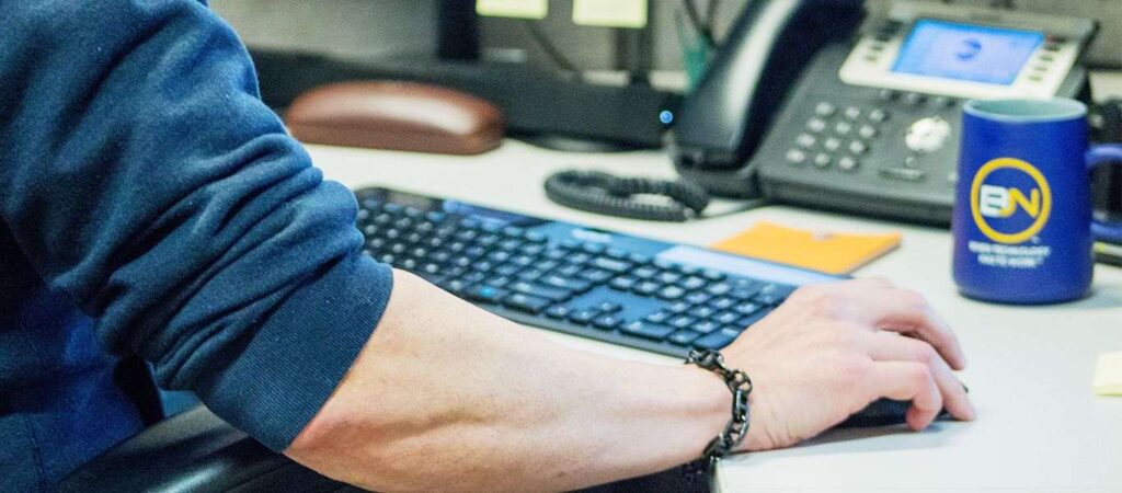 up close image of a guy working at his computer