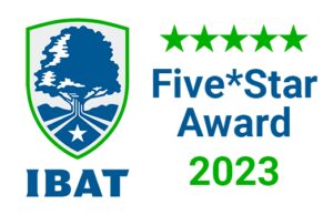 Logo of the IBAT Five-Star Award 2023, featuring a shield with a tree, five green stars above the text "Five-Star Award 2023," and "IBAT" at the bottom, symbolizing excellence in financial IT services.