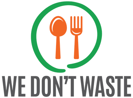 Logo of "we don't waste" featuring a green circle with an orange spoon and fork inside, next to the organization's name in black and orange text.