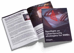 Two booklets titled "Spotlight on cybersecurity strategies for SMBs" by Integris, one open showing text and a photo, the other closed showing a keyboard and cybersecurity graphic on the cover.