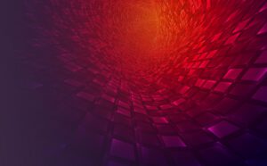 Abstract geometric tunnel with red, orange, and purple tiles creating a swirling, vortex-like effect, transitioning from dark to bright at the center.