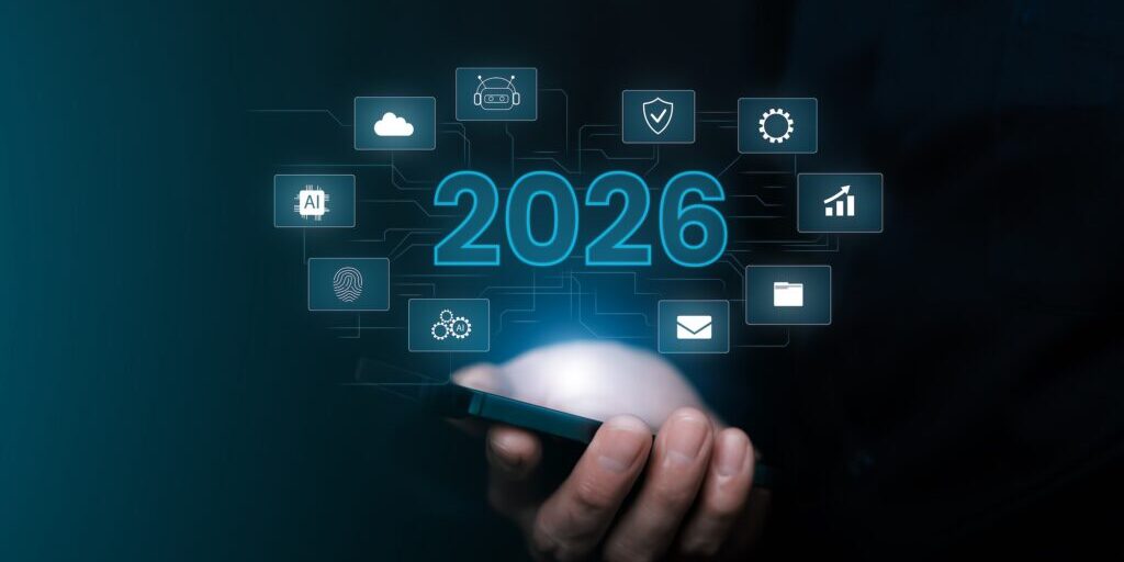 A person holds a smartphone with digital icons and the number 2026 hovering above it, symbolizing future technology and emerging MSP trends.