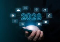 A person holds a smartphone with digital icons and the number 2026 hovering above it, symbolizing future technology and emerging MSP trends.