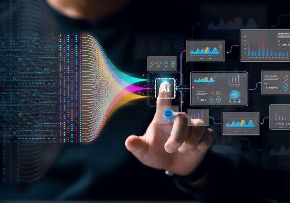 A person touches an AI icon on a virtual interface, with colorful data streams and analytic charts connected to it, symbolizing artificial intelligence, data analysis, and the emerging presence of Shadow AI.