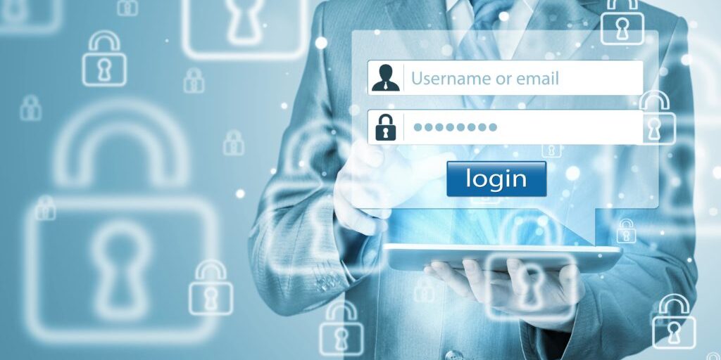 Person in a suit holding a tablet with login screen overlay, featuring username and password fields, surrounded by security lock icons.