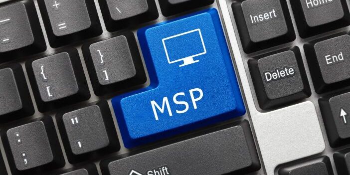 A computer keyboard with a blue key labeled "MSP" alongside an icon of a monitor, positioned among standard keys, perfect for IT MSP professionals.