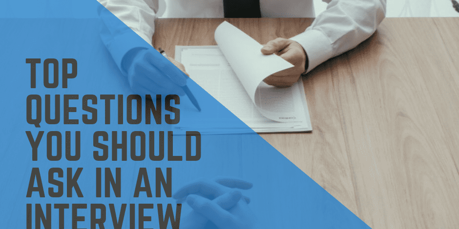 Image of two people at a table with a document, accompanied by a text overlay that reads, "Top Questions You Should Ask in an Interview."
