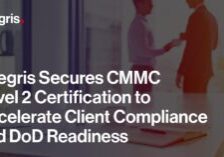 Office setting with two people shaking hands in the background; foreground features documents and glasses on a desk. Text overlays announce Integris achieving CMMC Level 2 Certification.