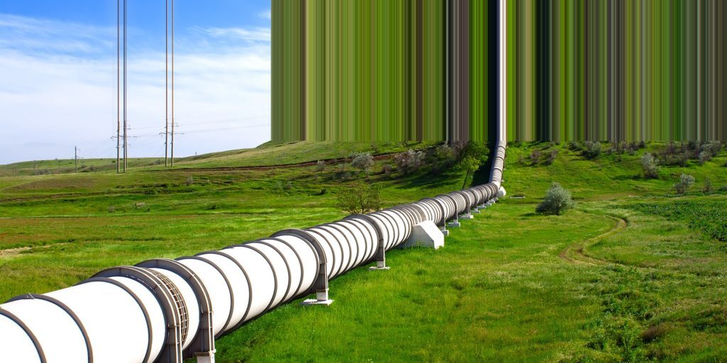An image of a pipeline across a wide grassy field with a glitched effect