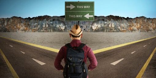 Asian tourist standing in the middle of crossroad