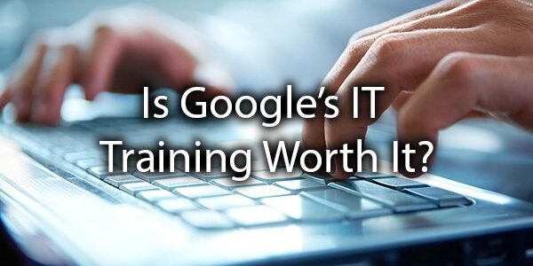 A close-up of hands typing on a laptop keyboard with the text "Is Google's IT Training Worth It?" overlaid.