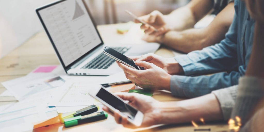 People looking at mobile devices