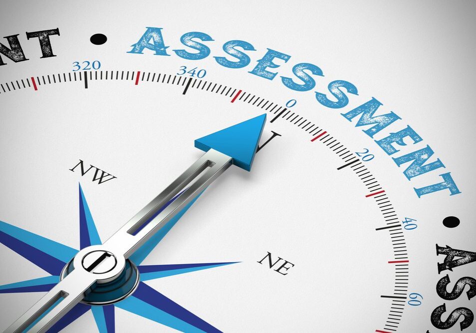 A compass pointing north toward the words "Paid IT Assessment" displayed prominently at the top center. The design includes typical compass elements like direction labels (N, E, S, W) and a blue arrow.