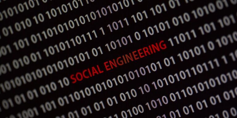 Binary code background with the words "SOCIAL ENGINEERING ATTACKS" highlighted in red.