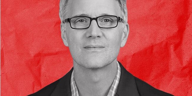 Black and white portrait of a man named Jed Fearon with the title Solution Advisor, Atlanta, on a red background.